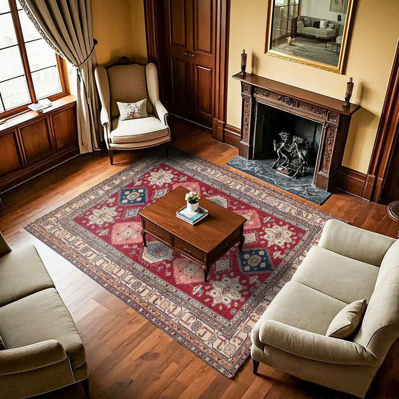 A living room styled with a 2026 trend rug in earthy terracotta tones and an organic pattern.