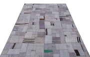 Teselya Purple Patchwork Wool Handmade Area Rug 5'3" x 7'4"